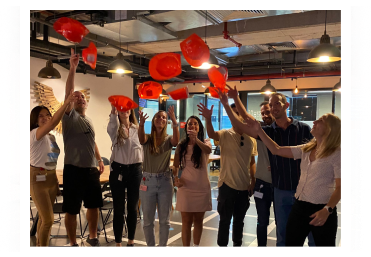 people throwing hats in the end of a course