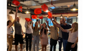 people throwing hats in the end of a course