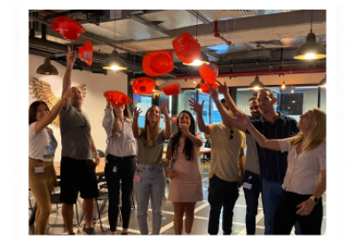 people throwing hats in the end of a course